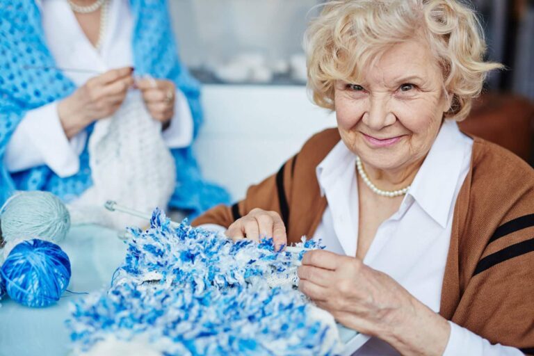 elderly woman knitting