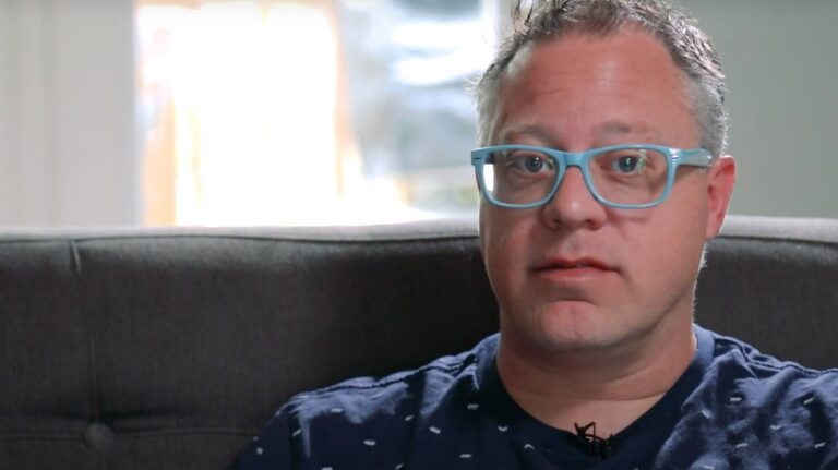 Man being interviewed about his walk-in tub