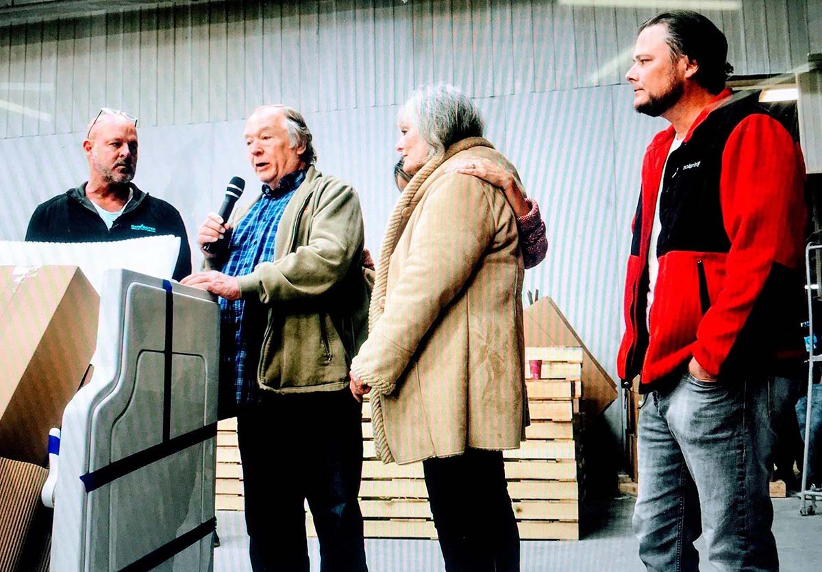 Giving a speech to an audience about his walk-in tub