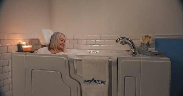 woman bathing in her walk-in tub