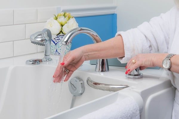 woman filling her tub