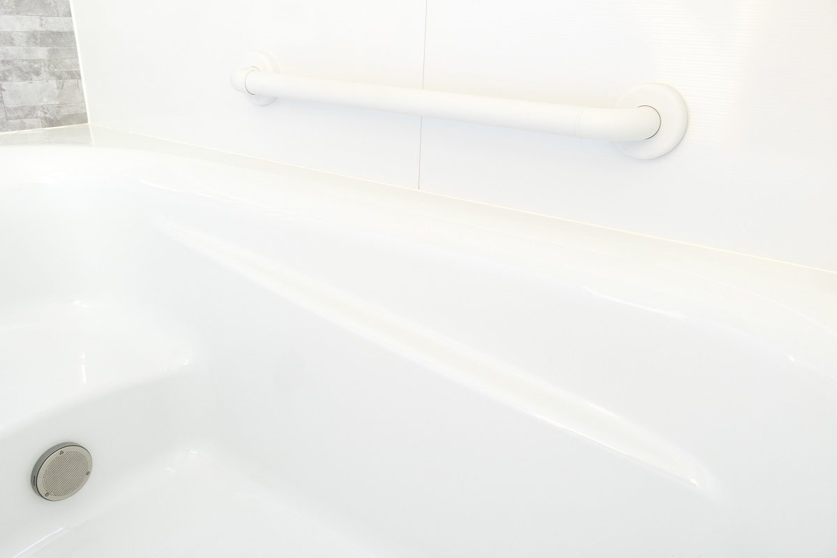 walk-in tub with a safety handrail