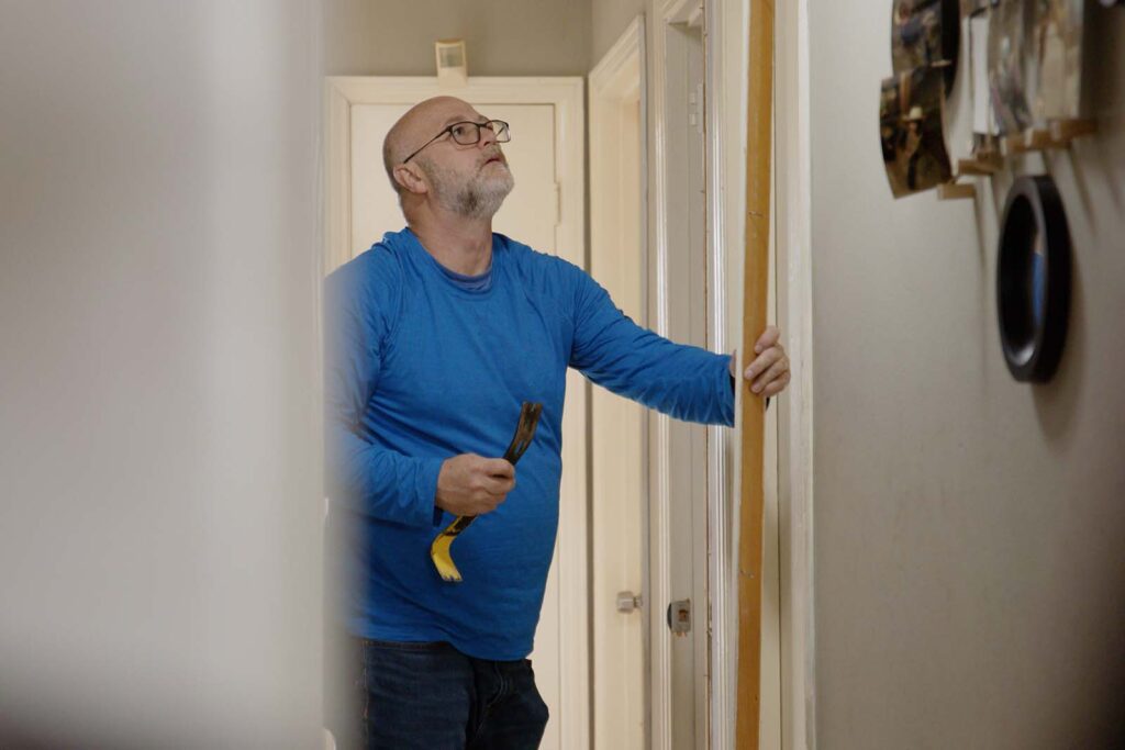 worker removing old walls