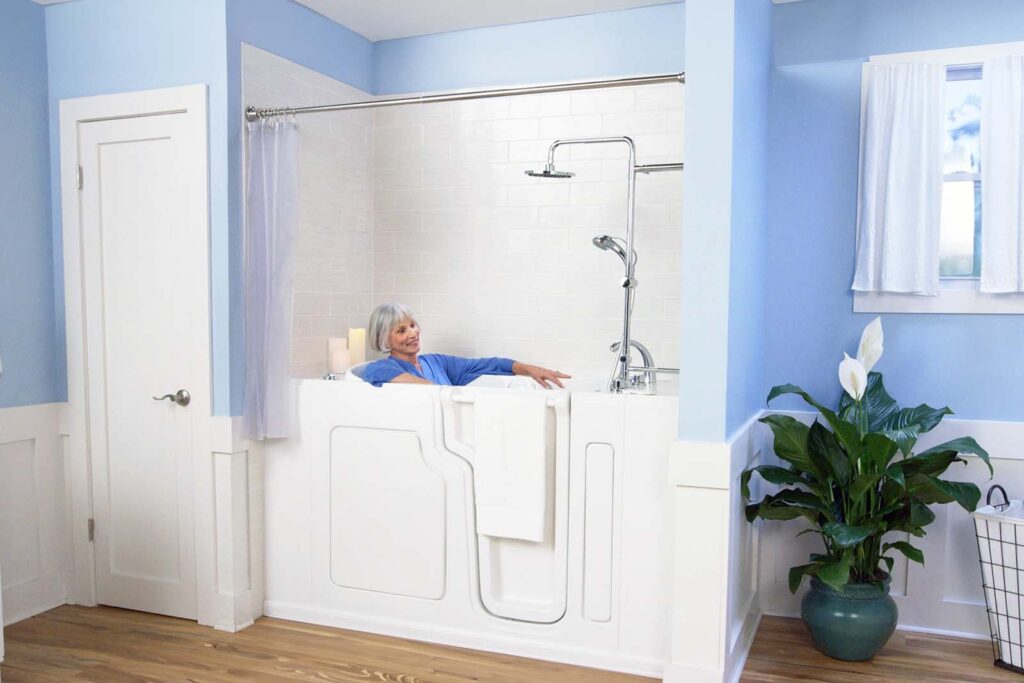 woman sitting in a tub shower combo