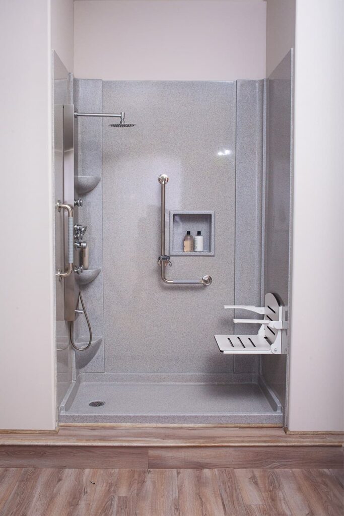 walk-in shower with a fold-down bench